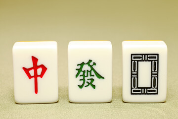 Chinese mahjong tiles, close-up of mahjong tiles on green background  