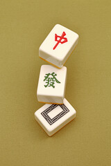 Chinese mahjong tiles, close-up of mahjong tiles on green background  