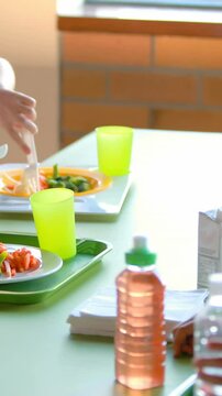 Kids having meal in cafeteria