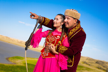 Kazakh woman and man in national costumes