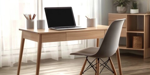 A laptop computer sits on top of a wooden desk, ready for use