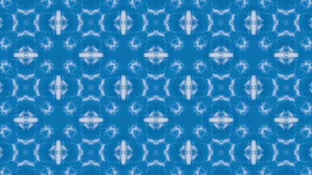 Blue and white patterned background with a blue and white design. The design is made up of squares