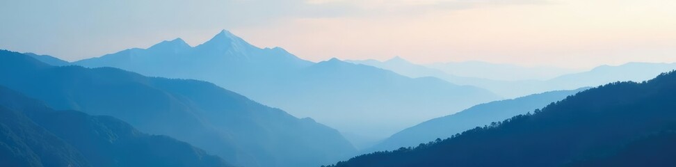 Morning fog slowly lifts to reveal the majestic misty peaks, blue hues, misty mountains, morning