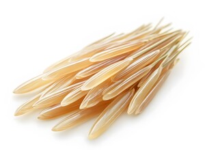 Group of uncooked orzo pasta aligned on a white background