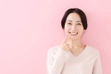 女性・歯