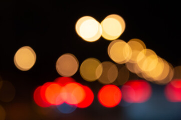 blurred background of night city and roads orange red and blue side lights and roads. High quality...