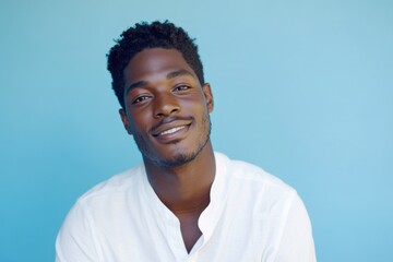 Smiling Man in White Shirt, Relaxed Expression on Blue Background. Generative AI.