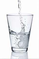 Water being poured into a glass. Isolated against a white background.Water being poured into a glass. Isolated against a white background.