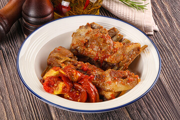 Baked lamb ribs with vegetables