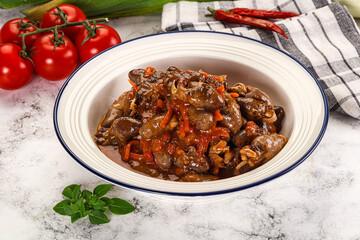 Baked chicken hearts with vegetables