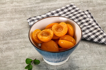 Sweet canned apricots with syrope
