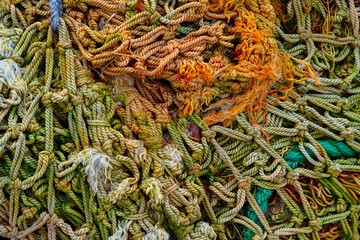  A pile of old fishing nets. Abstract background.  Close-up.