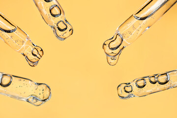 samples serum tests glass pipettes with drops of serum on a light beige background
