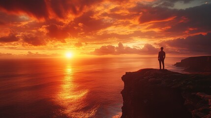 Fototapeta premium Solitary Figure at Sunset Over Dramatic Ocean Cliffs