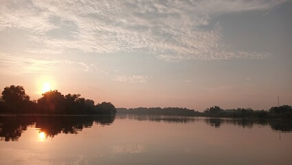 Obraz premium Morning view of river and full of green vegetation in Bojonegoro Indonesia