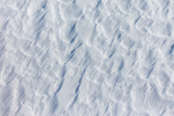 The snow is white and the ground is covered in it