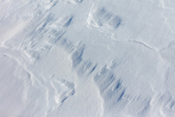 The snow is white and the ground is covered in it