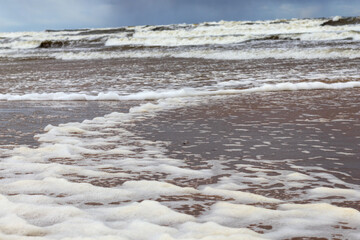 
you can see the foam formed by the waves of the sea.