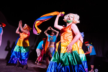 Vibrant Drag Queens Perform Energetically While Celebrating Pride With Colorful Flags at a...