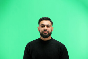 Obraz premium A man, close-up, on a green background