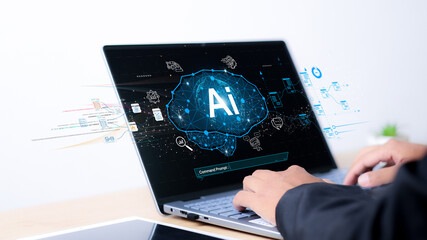 Chat with AI or Artificial Intelligence. Young businessman chatting with a smart AI or artificial intelligence using an artificial intelligence chatbot developed by OpenAI.