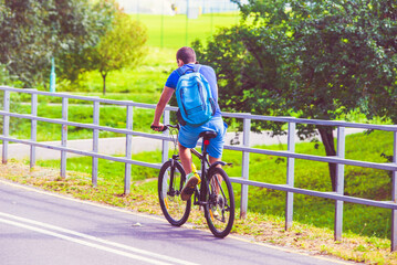 Fototapeta premium Cyclist ride on the bike path in the city Park 