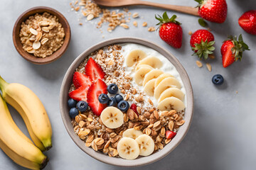 A fresh and healthy smoothie bowl topped with granola, sliced ​​banana, strawberries, and shredded coconut