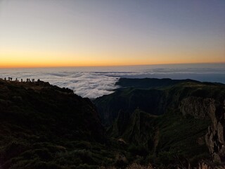 Breathtaking sunrise at Pico do Arieiro, sunrise above the clouds, hiking trial from Pico do Areerio to Pico do Ruivo. Madeira, Portugal