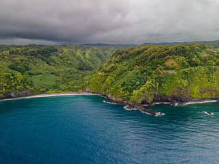 Panorama view to the Hawaiian Island of Maui with cloudy shape and sunset light impressions