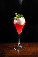 Refreshing Summer Cocktail With Vibrant Layers Served in an Elegant Glass, Garnished With Mint Leaves, Perfect for Sunny Gatherings and Festivities
