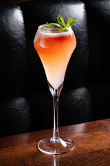 Savoring a Handcrafted Cocktail With Vibrant Layers of Colors and a Fresh Mint Garnish in an Upscale Bar Setting