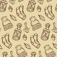 Cozy autumn pattern featuring lanterns, hats, acorns, and leaf designs in warm tones