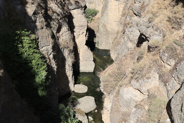 View into the gorge of the river Guadalevín in the city of Ronda, Andalusia, Spain