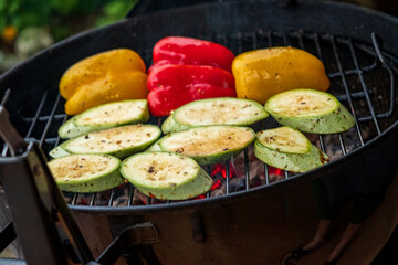Grilling Vibrant Vegetables Under a Warm Summer Sun, Capturing the Joy of Outdoor Cooking in a Backyard Gathering With Friends and Family