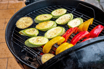 Vibrant Vegetables Sizzling on the Grill During an Outdoor Gathering in a Warm Summer Afternoon