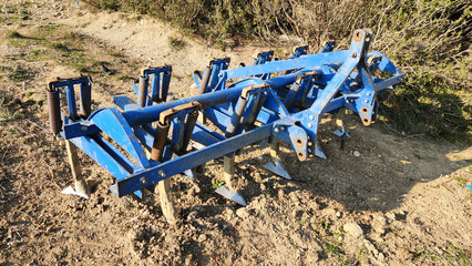 A plow, also known as a plough, is a vital agricultural tool used for turning, breaking, and aerating soil, preparing fields for planting crops and enhancing soil health.