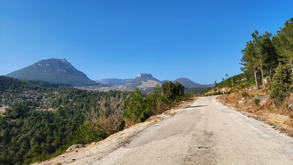 Rural asphalt road leading to Karakilic Village, located in the Taurus Mountains of Karaisali...