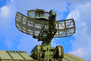 Air defense radars against a blue sky