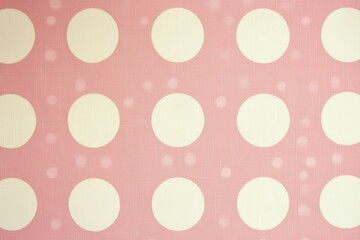 Soft pink fabric featuring a repeating pattern of large white polka dots, creating a playful and cheerful design ideal for textiles and decor