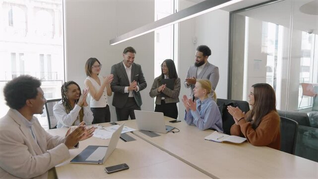 Business people, applause and congratulations for employee promotion, celebration or sale at the office. Happy corporate staff clapping for company growth, collaboration or teamwork at the workplace