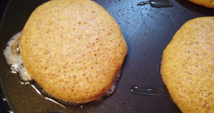 Close-up shot of the cooking process of shrimp cakes, used as a complement to traditional Mexican romeritos