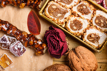 Sweet food Turkish delight on wooden background, assorted locum and candy for decorated backdrop