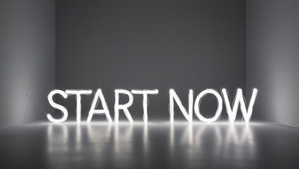 A minimalist design featuring the phrase "START NOW" illuminated in bright light, set against a dark background.