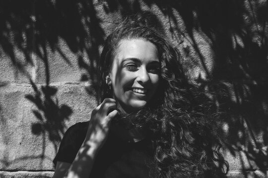 Greyscale Gen Z Portrait, Smiling Girl in the Summer Sun and Shadows