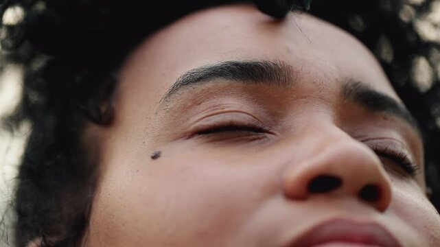 Young woman opening eyes to SKY feeling HOPE and FAITH, overcoming obstacles of meditative contemplative 20s female person