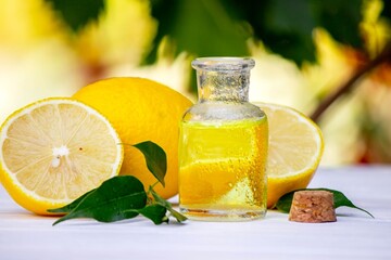 lemon oil in jars, fresh lemon. Selective focus. Nature