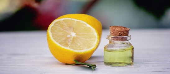 lemon oil in jars, fresh lemon. Selective focus. Nature