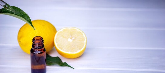 lemon oil in jars, fresh lemon. Selective focus. Nature