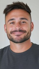 Fototapeta premium Portrait Of A Smiling Man In A Gray T Shirt