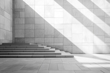 Sunlight streams through large windows, casting geometric shadows on sleek stone steps and walls in a modern architectural space